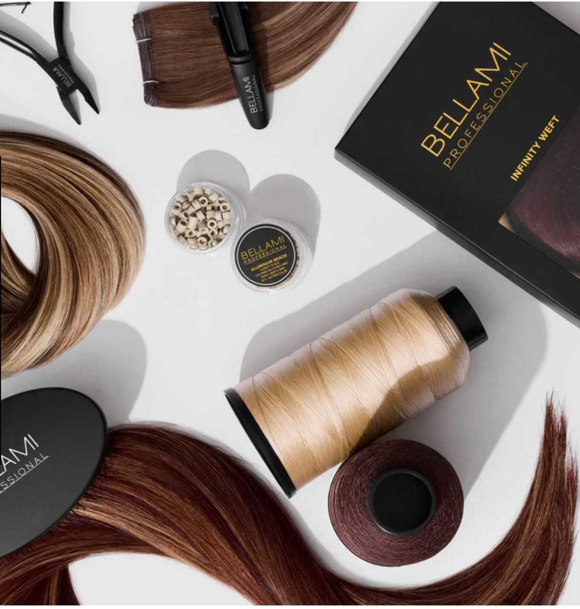 Hair extensions and tools including clips, thread, and beads on a white backdrop.